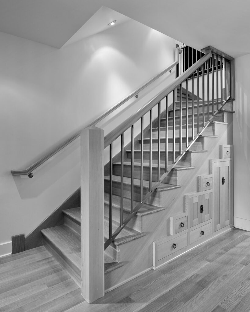 A staircase with storage space under the stairs
