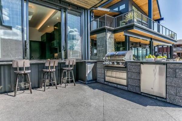 An outdoor kitchen outside a home