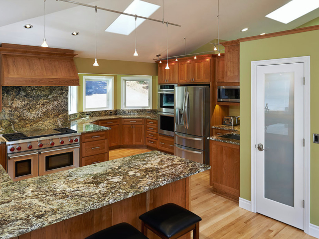 Marble countertops in a circular kitchen nook, as remodeled by W.L. Construction in Corvallis, Oregon.