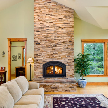 Simple design elements like this stone fireplace make the home more comfortable.